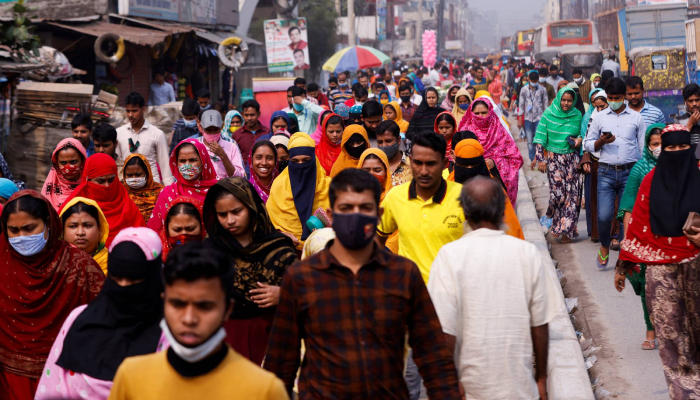 Garment workers go home during lunch break in Gazipur, Bangladesh, in February 2022